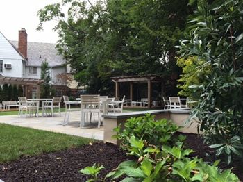 Secluded courtyard with terraces and lawn
